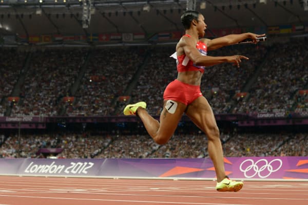 Carmelita Jeter, who helped Team USA to a gold in the 400-meter relay in London, will skip the national championships to nurse a sore quadriceps. (Adrian Dennis/Getty Images)